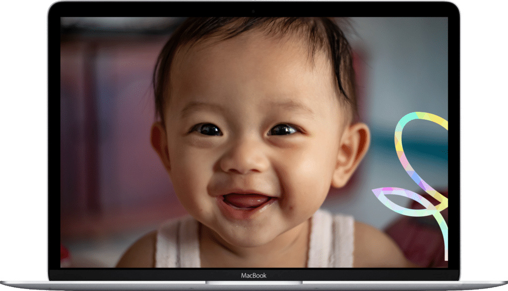 Baby smiling at camera