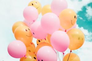 Balloons with happy faces on