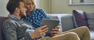 Couple reviewing information on a tablet