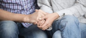 Couple holding hands