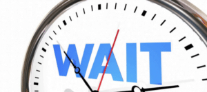 Clock ticking saying 'wait'