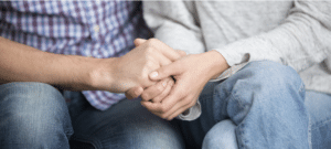 Couple holding hands