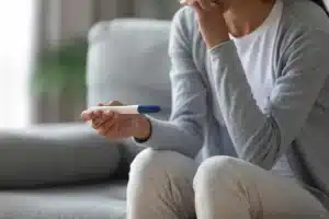 Woman looking at pregnancy test