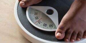 Feet on weighing scales, measuring 70 kilograms