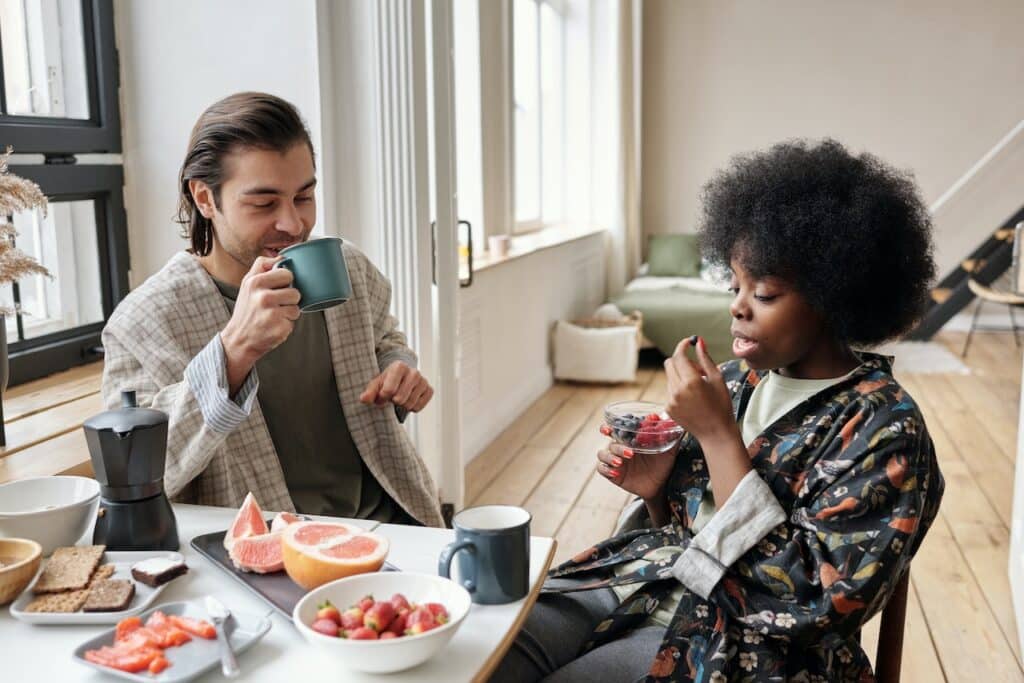 Man and woman having healthy breakfast together