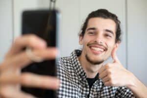 Man taking a selfie smiling