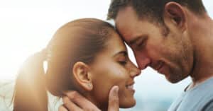 Man and woman smiling in sun